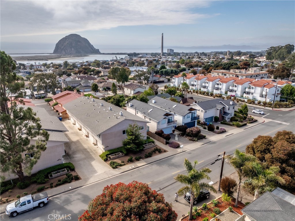 LIVE THE MORRO BAY LIFESTYLE WITH MORRO ROCK VIEWS! Step into this beautiful turnkey condo and enjoy the ultimate Central Coast living—just steps to Main Street and the Embarcadero with dining, shopping, kayaking, and coastal adventures right outside your door. This light-filled home features 2 spacious bedrooms and 2 full baths, thoughtfully designed with creative, artistic touches throughout. The inviting living room is warmed by a Fireplace Extraordinaire with Green Smart Technology, adding cozy ambiance and energy efficiency. The kitchen boasts new appliances. Upstairs and downstairs bedrooms each offer generous storage, including walk-in and double closets, with beautifully updated bathrooms. Enjoy fresh ocean breezes from your private balcony with a peek-a-boo view of iconic Morro Rock and the Pacific, the perfect spot to catch spectacular sunsets. Additional highlights include indoor laundry, ample storage, and a fully finished 2-car garage with cabinets and a workbench for projects or hobbies. Whether you’re into fishing, boating, hiking, surfing, biking, golfing, pickleball, or simply beachside strolls, everything is within easy reach in this prime Morro Bay location.