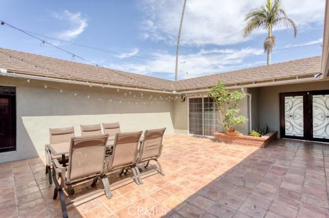 Welcome to this beautifully maintained single-level home featuring 5 spacious bedrooms and 2 full bathrooms, perfect for families or those who need extra space to work from home. As you enter through the wrought iron double doors, you're greeted by a private courtyard — an ideal space for relaxing, gardening, or entertaining. Inside, you'll find both a cozy family room with a fireplace and a separate living room, offering plenty of room to spread out. The flexible floor plan provides great flow for everyday living and gatherings. Located in a quiet, well-established neighborhood, you’ll enjoy peace and privacy while still being close to schools, shopping, and major routes.