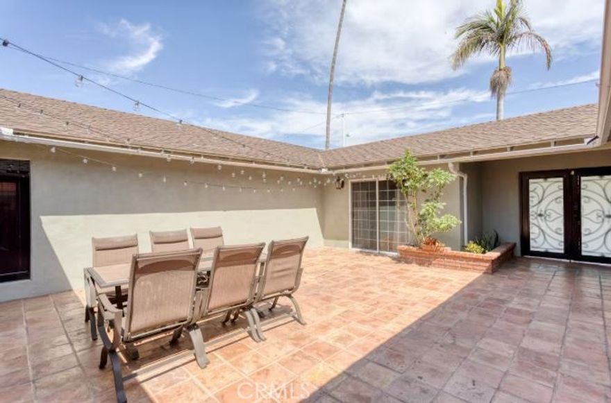 Welcome to this beautifully maintained single-level home featuring 5 spacious bedrooms and 2 full bathrooms, perfect for families or those who need extra space to work from home. As you enter through the wrought iron double doors, you're greeted by a private courtyard — an ideal space for relaxing, gardening, or entertaining.  Inside, you'll find both a cozy family room with a fireplace and a separate living room, offering plenty of room to spread out. The flexible floor plan provides great flow for everyday living and gatherings. Located in a quiet, well-established neighborhood, you’ll enjoy peace and privacy while still being close to schools, shopping, and major routes.