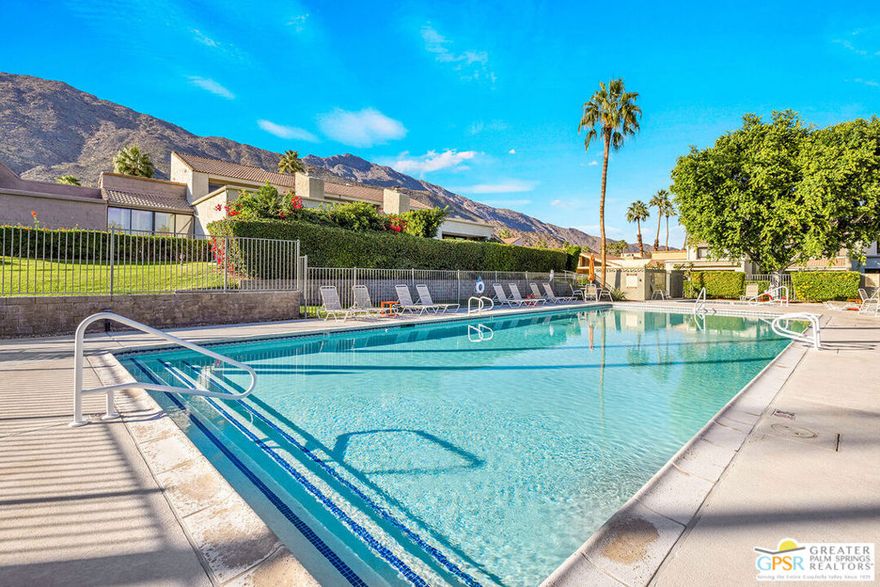 Welcome to one of the premier residences at Canyon West Estates, a gated 12+ acre community of 82 architecturally significant townhomes in desirable South Palm Springs, designed by renowned modernist architect Hugh Kaptur. This rare single-level home offers three bedrooms (or two bedrooms plus a den) and two baths, delivering both flexibility and comfort. The well-appointed kitchen features modern finishes and generous workspace ideal for anyone who loves to cook and entertain. The open living and dining areas feel light and airy, enhanced by a built-in bar and clerestory windows that flood the space with natural light. The spacious primary suite enjoys excellent separation from the guest rooms and includes an ensuite bath and a large walk-in closet. Outdoor living shines with an oversized west-facing patio, perfect for al fresco dining while taking in dramatic Mount San Jacinto views while overlooking the lush community greenbelt, dotted with mature, producing fruit trees. Additional highlights include a two-car garage with abundant storage cabinetry and a 240V outlet for electric vehicle charging. Canyon West Estates offers resort-style amenities including two pools and spas, two lighted tennis courts, and a spacious clubhouse with a fitness center and sauna. Located near hiking trails, restaurants, downtown Palm Springs, and the Smoke Tree Shopping Center.  Private showings available by appointment.