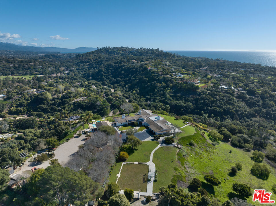 4400 Via Abrigada, a remarkable offering nestled within Santa Barbara's esteemed Hope Ranch. A first-time presentation on the market of 3 adjoining parcels spanning a total of 11.3 acres. This property provides a vast canvas for the creation of an unparalleled estate, allowing for 20,000 sq ft main house and two 7,500 sq ft guest houses. As you enter through a grand gated driveway, perched atop a flat surface, the property offers breathtaking city-to-ocean views. Currently gracing the land is a 7,500 sq ft single-level home, complete with a pool and pool house. The property is thoughtfully zoned for equestrian use, boasting bridle trails that meander through the lush landscape. Convenience meets luxury with private beach access. Located just minutes from Downtown Santa Barbara & Montecito.