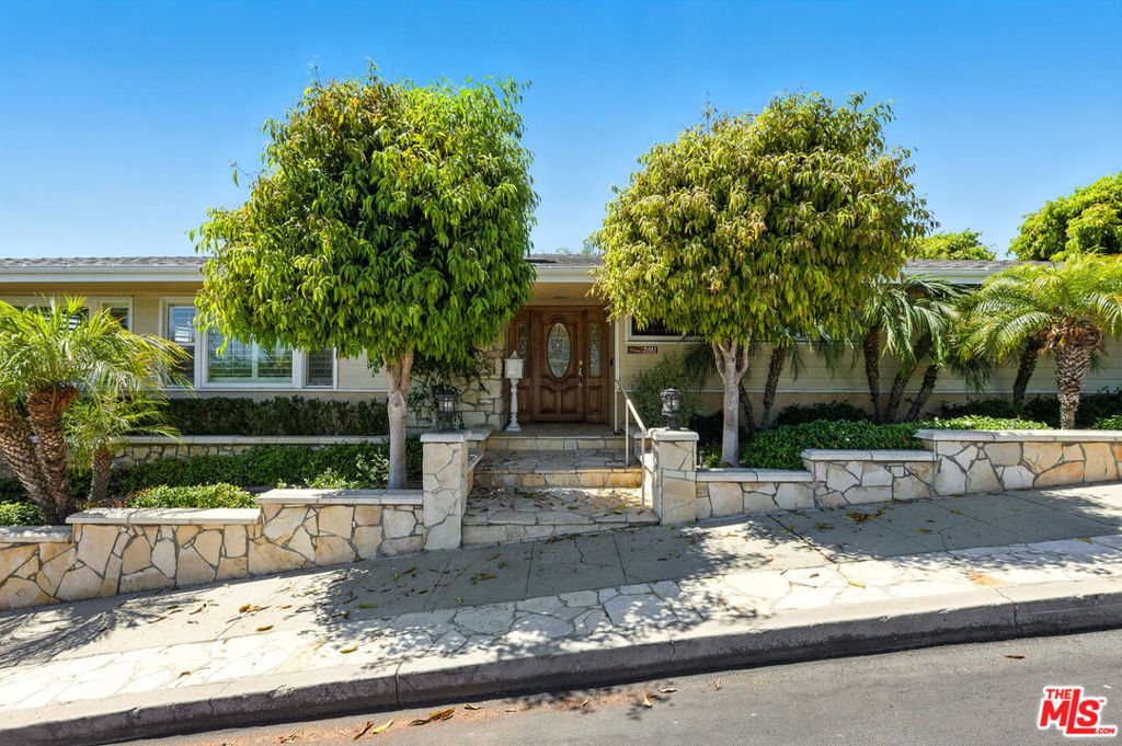 Welcome to 2401 Robalo Avenue, located in the coveted South Shores neighborhood of San Pedro. This beautiful home features 2,214 square feet of comfortable space, with four generous sized bedrooms that are perfect for family life or hosting guests. Nestled in a peaceful area, the property offers a generous 6,507 square foot lot, ideal for relaxing and enjoying the scenery. As you enter, the living room greets you with a cozy fireplace, white wooden shutters, tons of windows, creating a perfect setting for unwinding. The kitchen stands out not only for its functionality but also for the peek-a-boo ocean views and on a clear day, you might spot Catalina Island in the distance! It's a wonderful space for cooking or enjoying a quiet moment.The primary bedroom is spacious and already equipped with a closet organizer along with an en suite bathroom providing a personal retreat with its separate tub and shower. Outside, you'll find a spacious backyard that's great for entertaining, complete with a covered patio and lush greenery that makes it feel like your own private oasis. With practical features like central air conditioning and heating, a separate laundry room, and a detached two-car garage, this home offers everything you need for comfortable living. Enjoy the best of both worlds tranquility and style in this desirable South Shores gem.