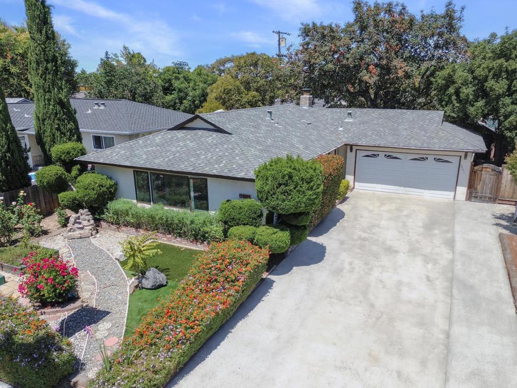 Fall in love with this beautifully updated 3-bed, 2-bath home in San Joses sought-after Cambrian community. Offering 1,248 sq ft of thoughtfully designed living space on a 6,195 sq ft lot, this move-in-ready gem blends comfort, style, and smart living. Luxury plank flooring, modern lighting, and an open layout create a welcoming feel throughout. The updated kitchen features quartz countertops, newer appliances, and an adjoining dining area with a charming garden window and hardwood cabinetry for added storage. Both bathrooms have been tastefully remodeled, and the spacious primary suite includes a large walk-in closet. A skylight brightens the living room, where a cozy fireplace and backyard views offer the perfect setting for relaxing or entertaining. Step outside to a lush, park-like yard ideal for BBQs or gardening, with a flower-filled front yard that attracts butterflies. With owned solar, a newer roof, and proximity to top schools, shopping, dining, and major tech companies, this is the one!