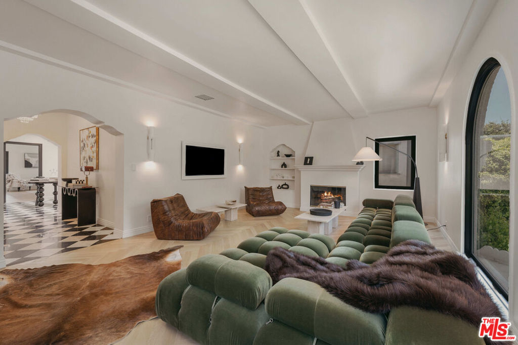 Presenting a rare opportunity to lease a fully furnished, newly remodeled duplex. This sun-filled upper unit features an open layout and natural light as well as sophisticated timeless design with modern amenities and advanced technology. This 3-bedroom, 3-bath residence is just steps from world-class shopping, dining, and entertainment, including Rodeo Drive, Beverly Drive, and the Golden Triangle. Designed for luxury living, the home features herringbone hardwood flooring throughout, Italian viola marble countertops with TuffSkin protection, and brand-new top-of-the-line appliances. A whole-house, three-stage water filtration system ensures purified water at every faucet and shower, While kitchen is equipped with reverse osmosis insta hot water dispenser. Additional highlights include a gas fireplace, central HVAC, smart home technology, in-unit laundry room with custom cabinetry, and a secure gated entry with monitored security cameras. Two dedicated parking spaces are included. Situated within the highly rated Beverly Hills Unified School District, this property offers access to some of the city's top schools and a premier lifestyle in one of Los Angeles' most desirable neighborhoods.