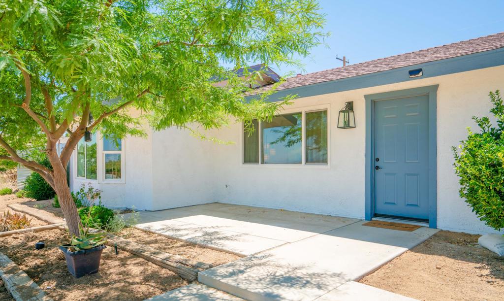 Purchase this Stylish and Modern Desert Retreat under the stars near Joshua Tree National Park. Welcome to this beautifully remodeled 3 bedroom, 2 bath home in the desirable Upper Friendly Hills neighborhood. This stunning retreat offers modern updates, breathtaking surroundings, and the perfect blend of comfort and style. Step inside and discover an inviting chef's kitchen with sleek modern cabinets, quartz countertops, subway tile backsplash, and a waterfall-edge island- a dream for cooking and entertaining. The spacious primary suite is thoughtfully positioned opposite the guest bedrooms and features a luxurious walk in shower, soaking tub, with a custom view window and custom wood wall accents. Enjoy seamless indoor to outdoor living with a large patio just off the kitchen, upper circular deck with natural gas for a firepit. This large property has RV parking and the outdoors is perfect for stargazing and entertaining under the desert sky. In 2021 a new roof, and AC were added, and natural gas in 2024 along with washer dryer in the house. In addition, this lot has complete privacy with a corrugated fence and ficus trees lining the back yard, and a large circular driveway. Located just minutes from Joshua Tree National Park, this home offers tranquility, breathtaking desert views, and a true escape into nature. Available for long term lease or purchase this great property. Schedule your showing today with Phyllis 760.851.8255Will consider shorter/ longer term Lease.House partially furnished.Business run in home must be preapproved by owner and city permit.