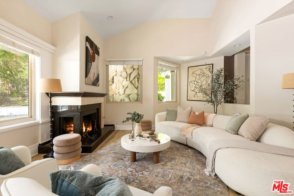Nestled in the prestigious North Ranch community of Westlake Village, this single-story residence offers over 4,300 sq ft of living space on a half-acre lot. With 4 bedrooms and 4 bathrooms, the home combines spacious interiors with a private outdoor retreat. The entryway with soaring ceilings and stone tile flooring opens to a bright formal living room with fireplace and walls of windows. A large dining room provides the perfect setting for gatherings, while the great room features another fireplace and space for entertaining. The kitchen is equipped with Sub-Zero, Wolf, and Bosch appliances, complemented by a large pantry and abundant cabinetry. The oversized primary suite includes high ceilings, a fireplace, direct access to the backyard, and a spa-style bathroom. Three additional bedrooms and bathrooms offer comfort and flexibility for family, guests, or office space. Outside, the backyard is designed for leisure and entertaining, complete with a heated pool, spa, built-in BBQ, and mature landscaping for privacy. Additional highlights include:Three-car garage with storage and EV chargers, solar panels for energy efficiency(buyer to assume solar payments), security system and electric gate, Samsung washer & dryer, and Smart toilets. Just minutes from The Promenade at Westlake, The Shoppes at Westlake Village, and fine dining options including Tuscany Il Ristorante, Stonehaus, and Mediterraneo. Outdoor enthusiasts will appreciate the nearby North Ranch Country Club, Westlake Lake, and miles of hiking and biking trails.