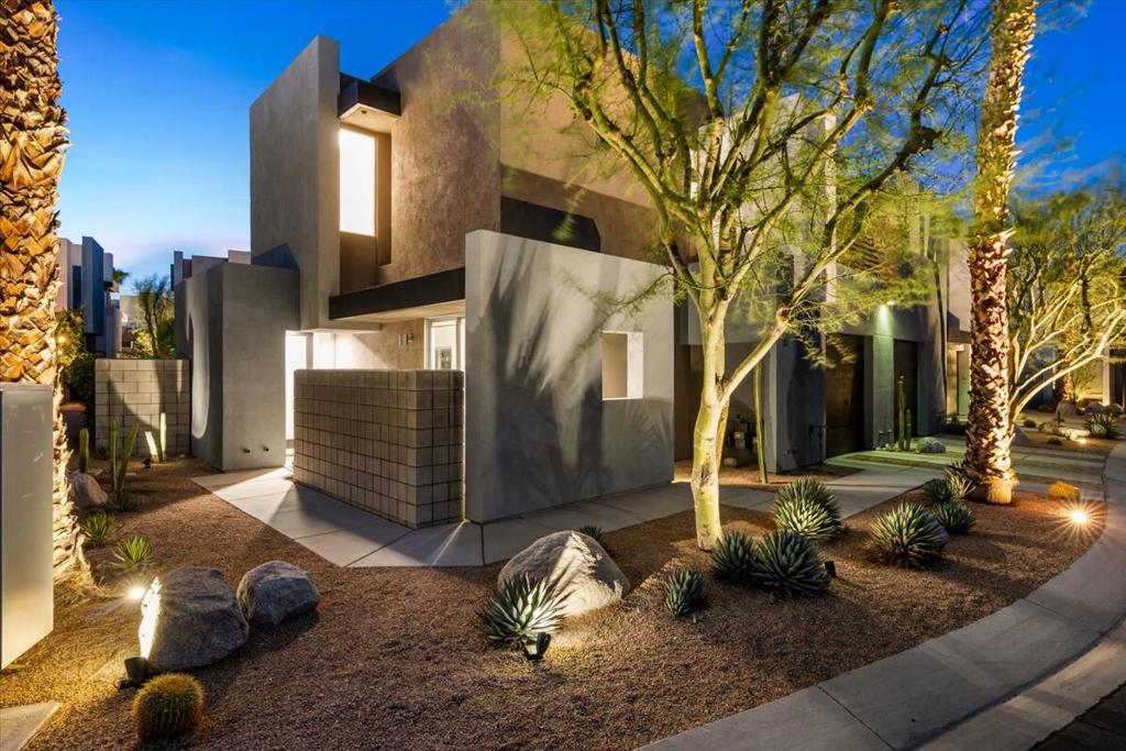 Modern and move-in ready end-unit townhome in the gated community of Palermo, just minutes from downtown Palm Springs. Designed by architect Chris Mills, this former model is tucked in a quiet interior location and includes a direct-access garage.The open-concept layout features dual sliding doors that lead to a private backyard with a covered patio. The outdoor space is clean and low-maintenance, ready for someone to create their own desert oasis. Inside, the kitchen retains its original cabinetry but features newly updated appliances (counter-depth fridge, cabinet-depth microwave, dishwasher, sink, disposal, and touch faucet all installed in 2024).Additional seller improvements include: luxury vinyl plank flooring upstairs and on the stairs, new 5'' baseboards, updated stair handrails, new LED lighting throughout, decorative kitchen fixtures, ceiling fans, custom blinds, and a glass privacy front door. The entire home and garage were freshly painted in Sherwin-Williams' ''Greek Villa'' in 2024. Upstairs are two ensuite bedrooms (one with a private terrace), a laundry area with new washer and dryer (2024), and ample storage. The garage is EV-ready with a Universal Tesla charger installed in 2024.Palermo offers resort-style amenities including two pools, two spas, a fitness center, and a clubhouse. Best of all you own the land (no lease!). A clean, stylish, and well-cared-for home in one of North Palm Springs' most desirable communities.