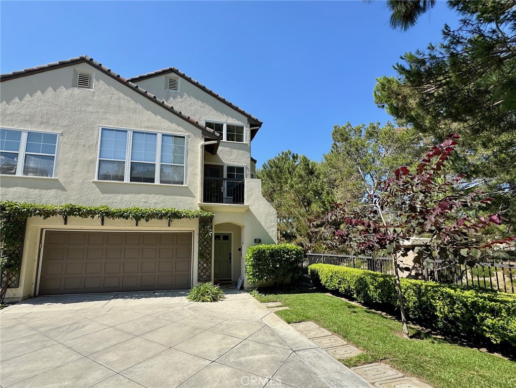 This contemporary end-unit townhome boasts beautiful views of nearby park below providing a tranquil living experience. With 2 bedrooms, a LOFT, and 3 full baths, the open floor plan creates a spacious and welcoming atmosphere. The living room features a cozy fireplace, soaring ceilings, and beautiful wood-style tile flooring and neutral carpet, adding warmth and style. The updated kitchen is a focal point, with marble slab countertops, newer sink and fixtures, mosaic backsplash, and a convenient breakfast bar. Upstairs, a versatile loft with a full bath and finished closet offers the potential for a third bedroom or a flexible living space. The spacious primary suite features tongue & groove wall details, a private balcony, a walk-in closet, attached bathroom with tub/shower combo, marble counters with dual sinks and newer fixtures. The second bedroom has recessed lights, walk in closet and a nicely appointed bathroom across the hallway with tub/shower combo and marble counters. Outdoor living is enhanced with a balcony, perfect for BBQing, and an attached 2-car garage with direct access. This townhome enjoys one of the best locations in a gated community called The Summit. Residents have access to resort-style amenities such as a pool, spa, tennis courts, BBQ areas, volleyball and basketball courts, and scenic trails. The community's prime location is in close proximity to the beach, Newport Coast Shopping Center, Fashion Island, Crystal Cove, beaches, 73 freeway, and John Wayne Airport. Zoned for award winning schools Newport Coast Elementary and Corona del Mar Middle/High School. With its modern updates, scenic surroundings, and a host of amenities, this townhome offers a perfect blend of comfort and convenience. NOTE: no fee to apply. Landlord looking for great credit over 750, good income 3x rent+ and good landlord references