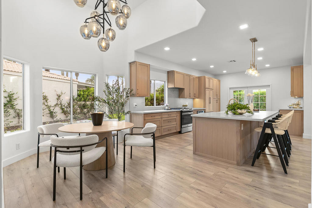 Every detail of this Laguna de la Paz home has been thoughtfully upgraded to create a modern, move-in-ready retreat with sweeping mountain views. Inside, new flooring, fresh paint, decorative lighting, all-new plumbing fixtures, and custom cabinetry with sleek quartz countertops elevate the entire living space. Two walls were opened for a seamless open-concept flow, while new sliding and French doors flood the home with natural light.The great room centers around a cozy gas fireplace and opens directly to a spacious patio where you'll take in uninterrupted mountain vistas. The private primary suite features a generous walk-in closet and its own covered patio, while guest rooms are thoughtfully separated for comfort and privacy.This property is also wired and ready for an ADU, offering future expansion potential for multi-generational living, a guest house, or income opportunity.Laguna de la Paz offers resort-style amenities including a 5-acre lake with walking paths and paddle boats, 15 pools, 16 spas, tennis and pickleball courts, a fitness center, and clubhouse. Just 3 miles from the Indian Wells Tennis Garden, this home combines the best of luxury upgrades, resort amenities, and full desert beauty.Buyers must be accompanied by their agent in order for the guard to grant access into the community. If a buyer does not have an agent, please contact the listing agent directly to schedule access and meet you at the gate.