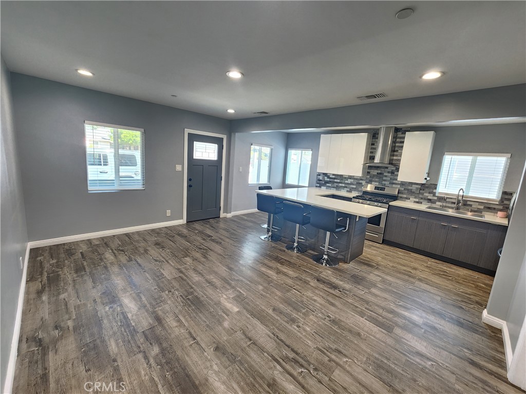 Enjoy this modern and spacious three bedroom in North Hills with ample parking and outdoor space. Close to freeway, schools, and shopping.