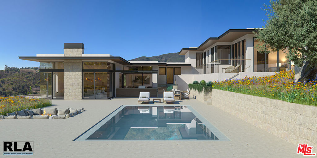 Amazing opportunity to build your dream home in the exclusive community of Ramirez Canyon in Malibu. This Woolsey Fire burn out property is located in a very private and peaceful gated neighborhood. With stunning ocean and mountain views, the residence re-imagines a luxury modern oasis befitting the most discerning eye for quality and sophistication. The home is comprised of a 5,828 square foot home, a detached 806 square foot 3 car garage with a 452 square foot apartment above the garage. The project takes full advantage of its sloping site with incredible views of the pacific ocean and the sunsets to the west from nearly every primary room in the house. Featuring a basement area with entertainment and exercise spaces. All levels of the home are connected to an internal/external courtyard with outdoor kitchen, pool, spa and fire pit. The design boasts an open floor plan kitchen, family, dining and great room area with 3 fully en-suite secondary bedrooms and a luxurious primary suite with generous dual walk-in closets and bathing area. With tall ceilings, modern detailing inside and out, and walls of glass that pocket away, this residence is as family friendly as it is an entertainer's showcase. Plans have been submitted to the city but have not yet been approved. Don't miss the chance to own this wonderful property! Renderings are of the new design and the other two photos are of the house prior to the fire.