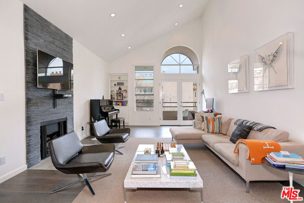 Gorgeously updated with sleek and modern finishes throughout, this 2BR/2.5BA 1,747 sq ft penthouse located in Prime Westwood has it all! Open floor-plan with seamless flow between living spaces, excellent for entertaining. Graciously-proportioned living room with tall ceilings, decorative fireplace and double glass doors that open to a covered patio and allows for abundant natural light. Formal dining area with floor-to-ceiling windows opens to renovated kitchen complete with S.S. appliances, caesar stone countertops, ample cabinet storage and dine-in breakfast area. Primary bedroom features a spacious walk-in closet, built-in desk/office area and en-suite back with dual sinks, soaking tub and separate shower. Large second bedroom with en-suite bath and floor-to-ceiling windows. Immaculately appointed building with swimming pool, two-car gated/secure parking, controlled access and additional garage storage. Inside laundry, central air/heat and prime location close to Century City Mall, Westwood shopping.
