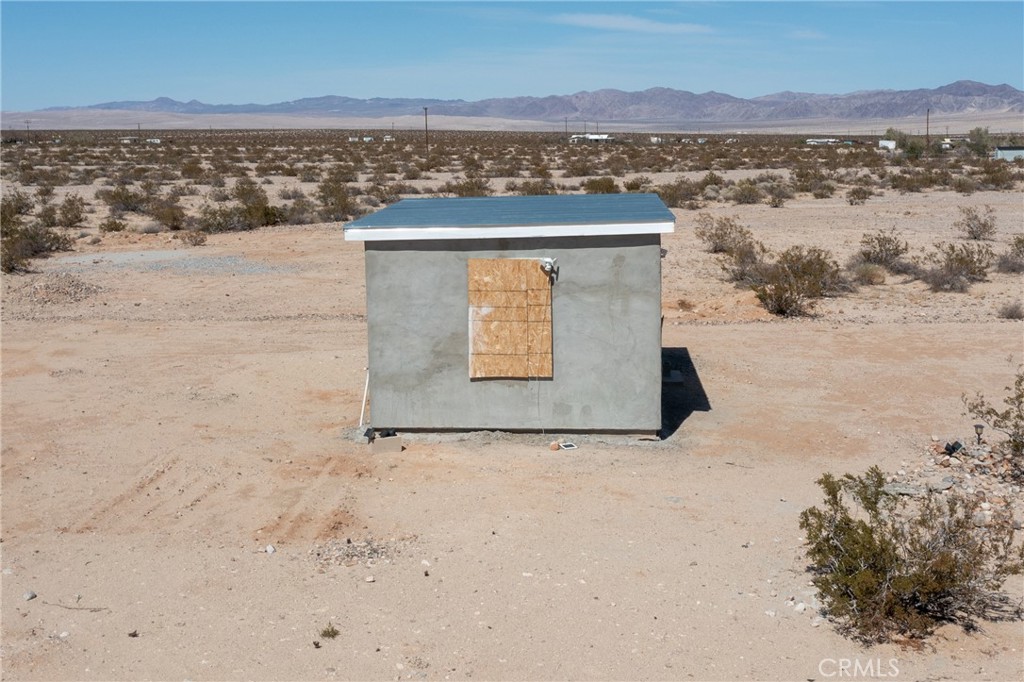 Looking for a place to enjoy the quiet desert life? This 5 acre parcel is just for you. The property has a cabin with new stucco and roof. A water meter is on the parcel. The seller has begun inspections and plans to convert the property to an SFR. See supplements.
