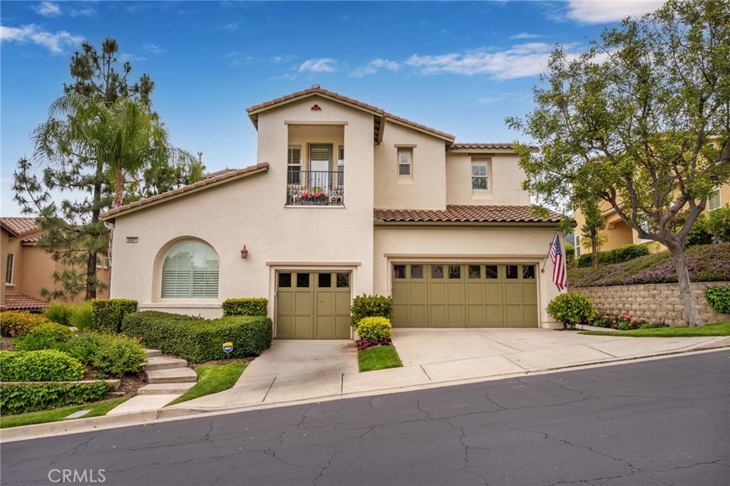 STUNNING TRILOGY CONDO WITH PANORAMIC VIEWS. Priced to sell! Don't miss this one. It's in a great location and is the largest model of the Trilogy condos with 2051 sq ft. It features an open floorplan with fantastic kitchen, dining area and family room with fireplace. There are 2 great bedrooms, 2 1/2 bathrooms, a bonus retreat area perfect for office, indoor laundry and your own elevator. The super wide covered balcony looks south over the Glen Ivy Golf Course, the entire Temescal Valley and mountains of the Cleveland National Forest! The guest bedroom has it's own private covered balcony looking north. Interior features include crown molding and plantation shutters throughout. The entire unit is tastefully decorated with upgraded granite counters with tile backsplash and stainless-steel appliances in the kitchen. The primary suite has a walk-in closet with built-in storage, walk-in tiled shower and dual vanities and tile counters. Trilogy is a fantastic 55+ community with loads of activities and amenities. There's a great resort pool and hot tub with BBQ's and fireplace. Enjoy summer concerts at the outdoor Amphitheater! The Blue Water Sports Lodge has a great work-out gym with updated equipment, a walking track and indoor lap pool. There's also tennis, pickleball, bocce ball, cards, ceramics room, card room, banquet facilities, and the list of fun activities goes on. Come live in Trilogy! You'll be glad you did!