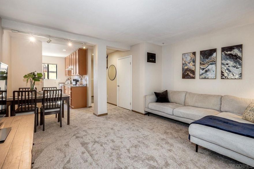 Welcome to this thoughtfully updated two-bedroom, one and half bath condominium tucked in a cul-de-sac community. Enter into an open main level where the living room flows into the dining area and kitchen, creating a seamless entertaining space. The kitchen offers updated cabinets and tile floor, installed by previous owners. The enclosed space adjacent to the living room functions as extra storage and designated laundry space. Upstairs, you’ll discover two comfortable bedrooms and a fully renovated bathroom. Plush new carpet climbs the stairs, fills the bedroom floors and the main floor for a cozy feel underfoot. With the fresh paint and neutral finishes, this condo feels bright, clean, and move-in ready.  Community amenities include a pool & spa. One assigned covered parking + additional permit parking is available on a first come, first served basis. HOA fees cover water, trash, and common grounds maintenance. New roof installed on the building in May 2025. Conveniently located near shopping, dining, and freeway access.