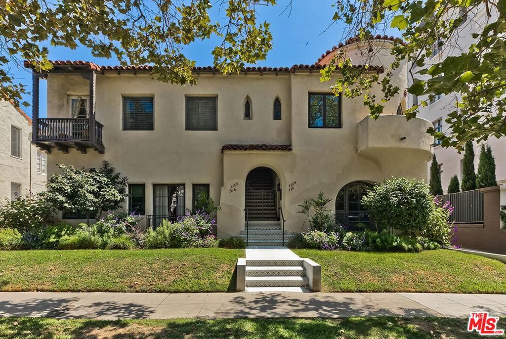 Stunning two bedroom fully renovated , one and a half bath lower unit in four unit trophy building. This Spanish Colonial Revival is listed in the National Registry as a historic property. The home blends old world charm with modern amenities. The wonderfully high ceilings & exposed beams plus the bright and airy sunken living space with bonus room and fireplace create the perfect entertaining area also a very large elegant dining room. Kitchen is great for gourmet with new gas stove/oven and all new appliances. Central heat and a/c insures the perfect temperature in every season. Also enjoy the convenience of your own washer/dryer in unit plus EV ready. Near art galleries and five star restaurants and shops. This one is ready to move into now, a must see.