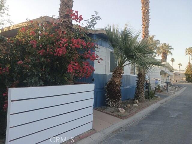 Great Home inside Palmdale Estates 55+ gated community 2 bedroom, 2 bath 1972 model that has been completely renovated. Renovations include: Complete kitchen, appliances, cabinets, bathrooms vanities, master tub, electrical, plumbing and drywalled through out. Reinforced underneath foundation (no 433a) new flooring, large storage shed, large indoor laundry room. New ramp has been installed. Adjacent to Indio Polo Grounds, community pool, spa, pickle ball, RV parking available at rear of park. Space rent for new owners will be $706. plus gas & electric. Must be park approved to open escrow. Call for a showing today.