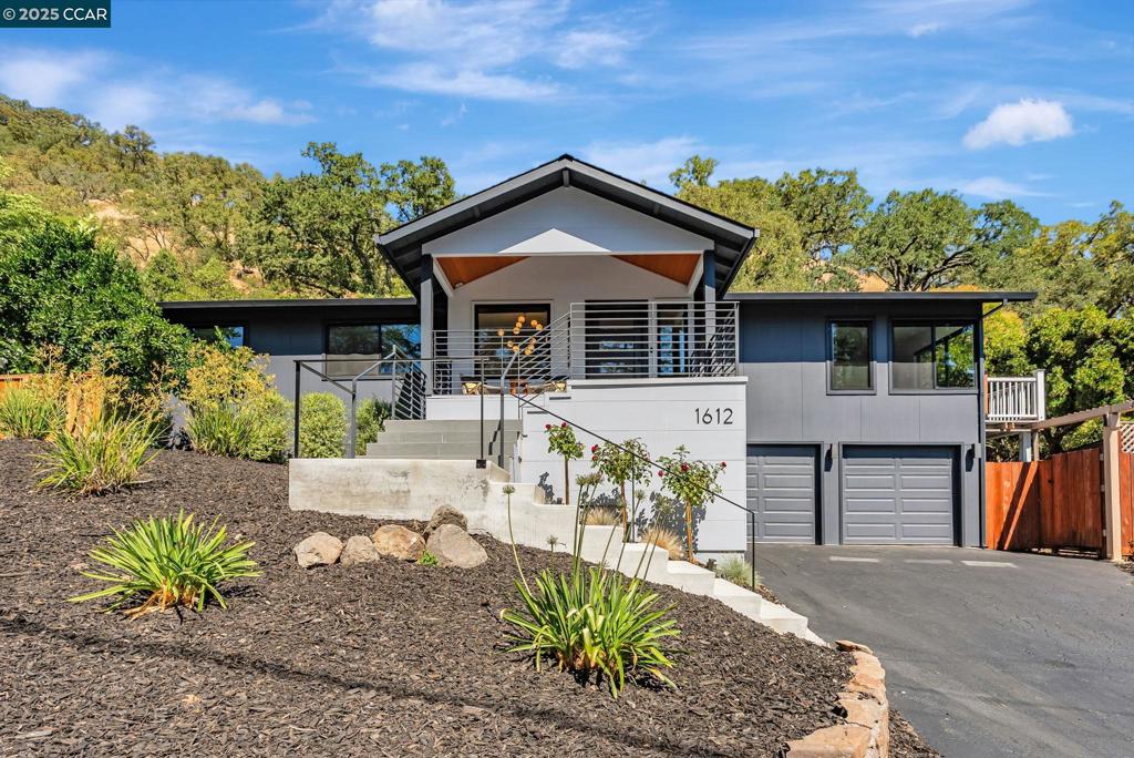 Extensively updated over the past 3 years, this turnkey 4BD/3BA home blends modern luxury with everyday comfort in westside Alamo. The chef’s kitchen features a 48” Monogram range with 6-burner cooktop, quartzite countertops, French door refrigerator, microwave drawer, wine fridge, & custom cabinetry with pull-outs. The open-concept layout flows into spacious living and dining areas with hardwood and tile flooring. The primary suite offers a spa-inspired bath w/soaking tub, double vanity, & dual shower heads including rainfall. All bedrooms include ceiling fans and custom closet organizers. Additional highlights: automatic blinds, 175+ bottle wine room, dedicated laundry room with sink, and separate mud room with laundry hook-ups. Exterior upgrades include a steel front door, new windows/doors, fresh paint, newer roof, gutters, and downspouts. The home has been fully rewired with updated lighting and electrical, and features a tankless water heater and covered patio with custom metal handrails. Additional improvements include HVAC system w/ducting & upgraded garage doors. Close proximity to the Iron Horse Trail offers easy access to biking, jogging, weekend strolls. All renovations completed w/permits. County updating records. Room count/sq ft diffent than public records.