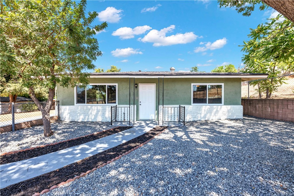 Beautifully renovated and move-in ready, this 3-bedroom, 1 bath home sits on a spacious 10,019 sq. ft. double lot with adu potential. Inside, the home has been completely updated with a brand-new kitchen featuring new countertops, modern cabinetry, pantry, stainless steel appliances including stove, microwave, and dishwasher. The open-concept living and dining areas showcase new laminate flooring, while all bedrooms feature new carpet. The bathroom has been remodeled with a new bathtub/shower, new vanity, and updated finishes. Throughout the home, new lighting fixtures and ceiling fans add comfort and style. Fresh exterior and interior paint, new desert landscaping, fenced in, and a detached 2-car garage. The expansive lot offers endless potential—whether for an ADU, outdoor entertaining, gardens, or a private retreat. Conveniently located near shopping, Menifee schools, and easy access to the 215 and 15 freeways.