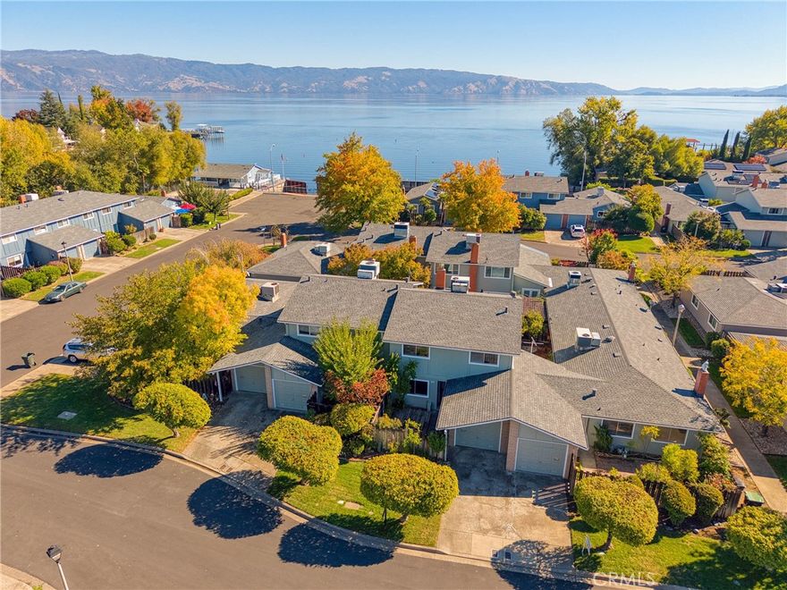 OWN YOUR PERFECT HIDEAWAY IN LAKESIDE NEIGHBORHOOD. Play where you live in this perfect hideaway, located in desirable North Lakeport nestled on Rumsey Bay. This 3-bedroom, 2 1/2-bath 2-story townhome is nestled in the premier lakeside community of Del Lago Estates. An all-electric kitchen opens to spacious dining and living room with a fireplace. New roof and rain gutters installed last year, and new exterior paint this summer. Extra-large front and rear courtyards with ample privacy. Situated just a stone’s throw from the in-ground pool for swimming and sunbathing, a clubhouse for parties and events with a covered patio /deck area overlooking Clear Lake where you can sit and watch the sun rise with a cup of coffee or experience the sunset with a glass of one of Lake County’s finest wines. Also enjoy a community garden filled with fruit trees and vegetables, and a seawall-protected marina with ample boat slips. An easy stroll through Del Lago’s tree-lined streets with manicured lawns and streetlights to historic north main street to downtown Lakeport for dining, entertaining, the lakefront Library Park and shops. Public transit is just steps away. Turn this “move-in ready” affordable home into your weekend retreat or full-time residence with low maintenance living. Please note furnishings are virtually staged.