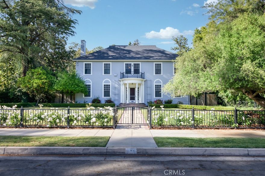 Wish you could find a home that offers timeless style, abundant space, and a neighborhood that actually feels like a destination? Welcome to one of Fresno's best-kept secrets - Wilson Island. Tucked into this storied enclave sits a true Colonial Revival jewel, where historic charm meets modern livability in the most effortless way.

This is the kind of home you dream about when you've outgrown cookie-cutter and crave something with soul. From the stately exterior to the thoughtfully designed interior, this 5-bedroom, 4.5-bath residence offers room to live, work, and entertain without compromise. Need flexibility? A bonus room with a closet gives you space for a home gym, office, guest suite, or all three.

Imagine sun-drenched mornings in the attached sunrooms off the primary suite and secondary bedroom which is perfect for coffee, journaling, or just a quiet moment to yourself. Hosting? The formal layout flows easily into multiple gathering spaces, inside and out. A private backyard retreat with a sparkling pool and shaded patio sets the scene for summer parties, milestone celebrations, or weekend recharge sessions.

Plus, with secure gated parking, a corner-lot presence, and a location steeped in character and community, this is more than just a home - it's a chance to live in one of Fresno's most desirable, history-rich neighborhoods.