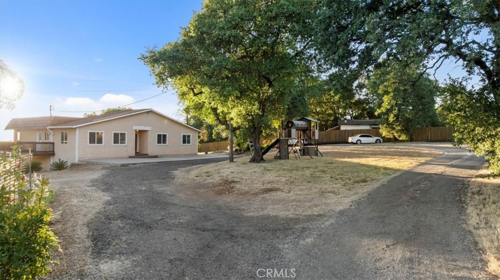 Call 346-228-7770 to schedule a showing.
Tucked away in the rolling hills of Oroville, this stunning 5-bedroom, 4-bathroom home sits on over 5 acres and offers space, comfort, and thoughtful upgrades throughout. In addition to the main 4-bedroom, 3-bathroom one-story residence, the property includes a fully finished 510 sq ft in-law unit with a private entrance, living area, kitchen, bedroom, and full bath—ideal for extended family or rental income. Inside the main home, you'll find rich wood flooring, high ceilings, and an open floor plan centered around a cozy wood stove. The gourmet kitchen features granite countertops, wood cabinetry, stainless steel appliances, a gas cooktop, and a large breakfast bar. The home includes both a primary and junior suite, each with en suite bathrooms and generous closets. Additional features include a 3-car garage, indoor laundry, a storage shed, affordable South Feather Water, a small vineyard, multiple fruit and nut trees, a playground, and an automatic gated entry. Peaceful, private, views of the coastal ranges and the Sutter Buttes. It's move-in ready—this is country living at its best, just minutes from Lake Oroville. Don't miss this amazing opportunity. Call today for a private showing.