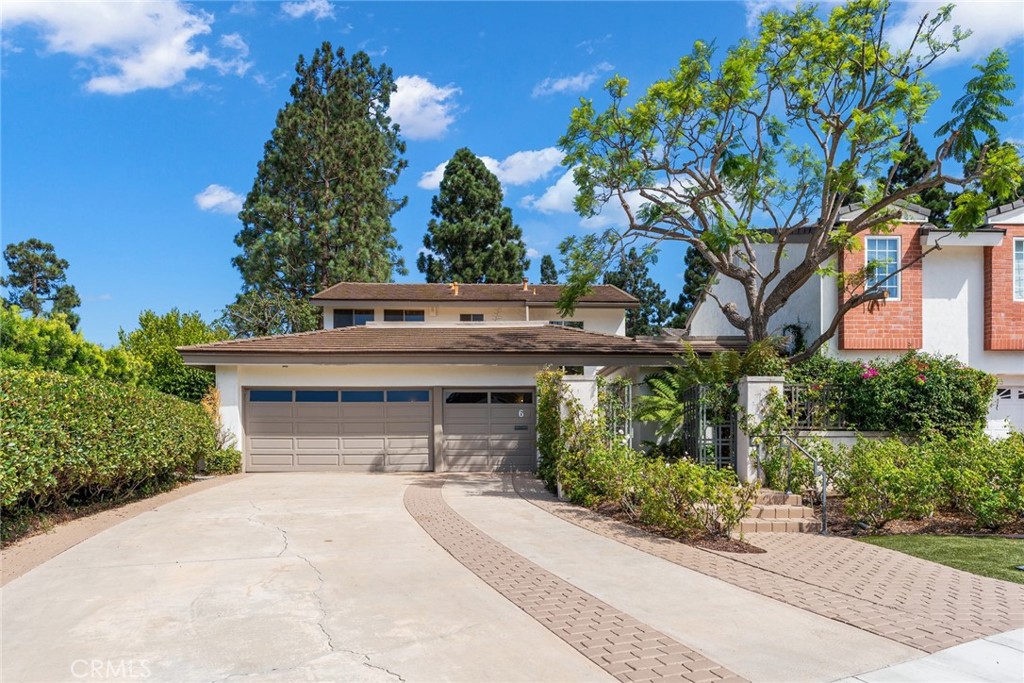 Welcome to 6 Rue Marseille, a beautifully maintained 3,199 sq ft home tucked away on a generous lot within the exclusive guard-gated enclave of Big Canyon in Newport Beach. This inviting 3 bedroom, 2.5 bathroom residence offers a harmonious blend of space, privacy, and classic design, perfect for comfortable everyday living and effortless entertaining.
The home features an open and airy layout with soaring vaulted ceilings, hardwood floors, and expansive windows that fill the living spaces with natural light. The spacious living room overlooks lush garden views and is anchored by a cozy fireplace, creating a warm and welcoming ambiance. A separate dining area connects easily to a well-equipped kitchen with granite countertops, custom cabinetry, premium appliances, and a large skylight. An adjoining casual dining space and family room provide flexibility for daily use.
The main-level primary suite is a peaceful retreat, complete with its own fireplace, private patio access, office nook, walk-in closet, and an ensuite bathroom. Upstairs, two additional bedrooms share a full bath, ideal for family, guests, or work-from-home arrangements.
Outside, the landscaped backyard offers a serene escape, surrounded by mature greenery, perfect for relaxing or hosting gatherings. Additional highlights include a three-car garage, extended driveway, and a prime location on a quiet cul-de-sac.
Enjoy all the benefits of living in one of Newport Beach’s most sought-after communities, just minutes from world-class shopping, dining, and coastal attractions.