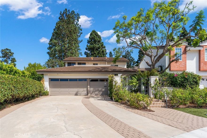 Welcome to 6 Rue Marseille, a beautifully maintained 3,199 sq ft home tucked away on a generous lot within the exclusive guard-gated enclave of Big Canyon in Newport Beach. This inviting 3 bedroom, 2.5 bathroom residence offers a harmonious blend of space, privacy, and classic design, perfect for comfortable everyday living and effortless entertaining.

The home features an open and airy layout with soaring vaulted ceilings, hardwood floors, and expansive windows that fill the living spaces with natural light. The spacious living room overlooks lush garden views and is anchored by a cozy fireplace, creating a warm and welcoming ambiance. A separate dining area connects easily to a well-equipped kitchen with granite countertops, custom cabinetry, premium appliances, and a large skylight. An adjoining casual dining space and family room provide flexibility for daily use.

The main-level primary suite is a peaceful retreat, complete with its own fireplace, private patio access, office nook, walk-in closet, and an ensuite bathroom. Upstairs, two additional bedrooms share a full bath, ideal for family, guests, or work-from-home arrangements.

Outside, the landscaped backyard offers a serene escape, surrounded by mature greenery, perfect for relaxing or hosting gatherings. Additional highlights include a three-car garage, extended driveway, and a prime location on a quiet cul-de-sac.

Enjoy all the benefits of living in one of Newport Beach’s most sought-after communities, just minutes from world-class shopping, dining, and coastal attractions.