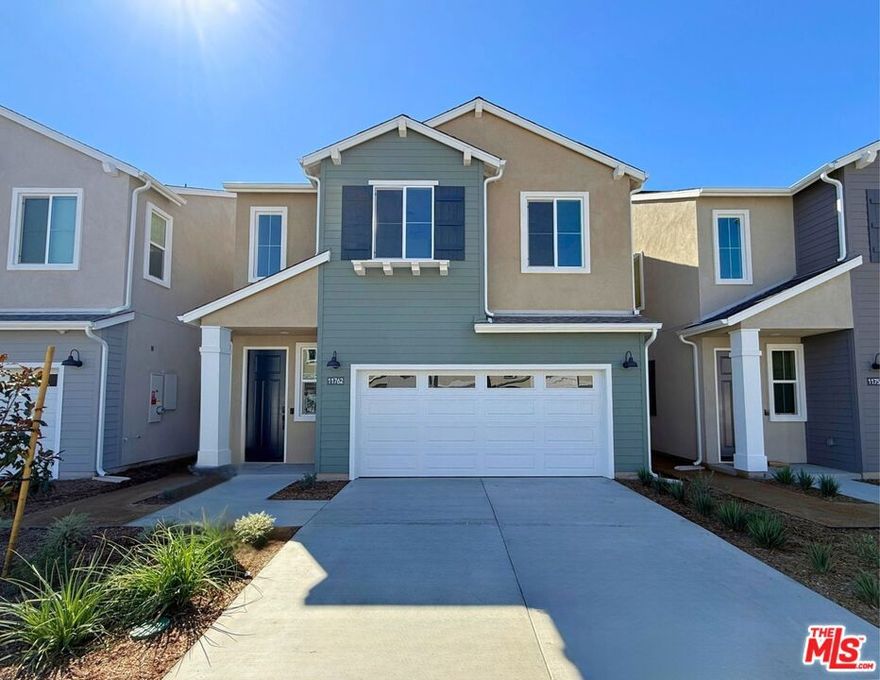 Move-in ready and brand-new, this dream home delivers the space, efficiency, and style that older resale homes can't match. Pull up to your private driveway and attached two-car garage, a rare feature in new construction homes. The curb appeal is clean and welcoming, with fresh architecture and thoughtful details that set the tone for what's inside. Enter the front door into a bright, open floor plan with LVP flooring and contemporary finishes throughout. The kitchen stands out with quartz countertops, white shaker-style cabinets with undercabinet lighting, and a tile backsplash. The kitchen flows naturally into the great room area, ideal for entertaining or relaxed family living. A first-floor bedroom and full bath add flexibility for guests, family, or a home office. Upstairs, the spacious loft provides a second living area, while the primary suite features an upgraded tile shower. Two additional bedrooms, a full bath, and a laundry room with upgraded upper cabinetry complete the second level. Step outside and enjoy a large, usable backyard--a true standout in this market. Whether you're hosting gatherings, planting a garden, or creating a play space, this backyard gives you room to live and grow. This home includes energy-efficient construction, solar panels (available for lease or purchase), and the peace of mind of a builder warranty. Located within a well-rated school district, this is a smart, turn-key choice for anyone looking for new construction without the wait--no repairs, no updates, no surprises.