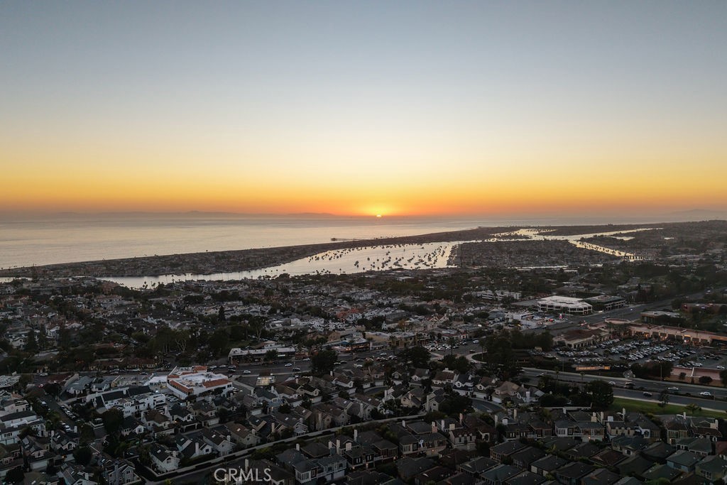 Remodeled Coastal Masterpiece with 300° Ocean Views in Coveted Corona del Mar
Welcome to 2719 Setting Sun Drive—an extraordinary coastal sanctuary perched above the Pacific, offering unparalleled 300-degree ocean views from nearly every room. This completely remodeled residence blends timeless elegance with modern sophistication, capturing the essence of luxury living in Corona del Mar. Step inside to discover a light-filled, open-concept layout where expansive glass walls frame sweeping vistas from Catalina Island to Newport Harbor and Palos Verdes. The heart of the home is a designer kitchen featuring a waterfall-edge island, custom light wood cabinetry, quartz countertops, and high-end appliances. A marble backsplash and gold-accented fixtures add warmth and refinement, while dual-tone cabinetry and pendant lighting elevate the space with contemporary flair. The seamless indoor-outdoor flow leads to ocean-facing terrace, ideal for entertaining or quiet reflection. Whether you're hosting sunset gatherings or enjoying morning coffee with sea breezes, every moment here is infused with coastal serenity. The primary suite is a private retreat with floor-to-ceiling windows, spa-inspired finishes. Additional highlights include smart home upgrades, wide-plank flooring, recessed lighting, and a thoughtfully curated palette of natural textures and modern finishes. Every detail of the remodel was executed with precision, creating a home that is both visually stunning and functionally exceptional. Don’t miss this rare opportunity to experience a coastal jewel with unmatched views and timeless design. Schedule your private showing today.