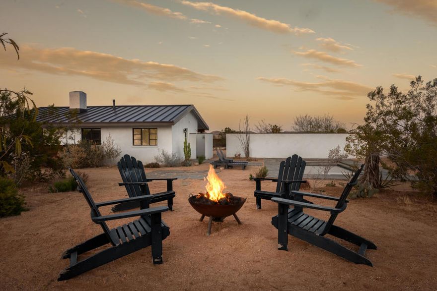 A quiet, design-forward refuge on five pristine acres in the high desert, Heiwa Cottage balances simplicity with a rare sense of intention. Thoughtfully reimagined and updated throughout in 2021 with meticulous attention to detail and quality craftsmanship, the home was shaped with a focus on form, function, and timeless comfort. Its inspiration, part Scandinavian fisherman's cottage, part Japanese country home, comes through in the warmth, restraint, and quiet beauty that define the space. Inside, two bedrooms and two bathrooms are unified by flagstone floors and an original brick fireplace that anchors the living room. The primary suite opens directly to a sun-washed patio with a pool, spa, and outdoor shower, creating an effortless indoor outdoor flow that feels natural to desert living. Set within an incredible native garden, the property blends seamlessly into its surroundings, offering privacy and an unmistakable sense of place. Brought to life by Todd Nickey, co-founder of the acclaimed design studio Nickey Kehoe, Heiwa Cottage stands as a refined and rare retreat in Yucca Mesa, equally suited as a full-time residence, an incredible vacation home, or a high-performing short-term rental. Just 15 minutes from Joshua Tree National Park.