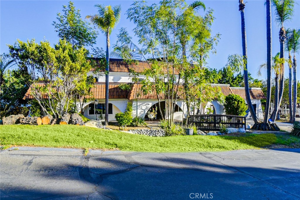 Tranquil semi-rural location! Plus unique floor plan. Experience this Spanish estate-style property, ideally situated at the end of a cul-de-sac private street with 24,240 square feet lot and the promise of tranquility. Perfect Entertainment home featuring a large wrap around yard, rock pond and fountains, pool and jacuzzi. 5 bedrooms and 3.5 baths located in upscale hard to get Yorba Linda neighborhood. Close to Jessamyn West Park, and Fairmont Knolls Park. Access to desirable Yorba Linda High School and other award winning schools. Stainless Kitchen Appliances, Hardwood Floors, Granite Counter tops in all of the bathrooms, Huge Laundry Room, Entertainer's Backyard featuring a gazebo, bar, BBQ and fountain area. Large Bedrooms, Front Yard features Waterfalls, Fruit Trees, Plenty of parking for RV, Bonus Room perfect for home theater or gym.