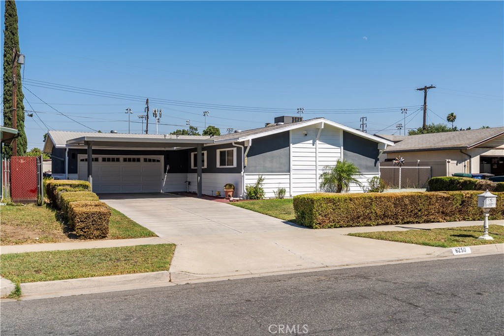 Welcome to 6250 Hillside Ave. located in the heart of Riverside. This charming 3-bedroom, 2-bathroom residence offers 1,200 square feet of living space on a 5,935 sq ft lot size and built in 1964. Step into an open floor plan with beautiful natural lighting, Neutral interior wall and tile floors colors. Nice living room that offers a cozy tile fireplace with custom wall with laminate wood with neutral colors, recess lighting. Gorgeous kitchen with wood cabinets, granite counter tops, kitchen is equipped stainless steel appliances, including a stove, dishwasher, microwave, refrigerator, sink and kitchen faucet with a touchscreen. Dining room provides a nice large window and large patio doors with elegant plantation shutters that lead to patio area. Master bedroom provides closet space and private bathroom. All bedrooms have closet space with nice custom wood doors. Bathrooms have been remodeled with new tub, custom tile and interior paint. Bonus room that offers a bar area and custom cabinets and closet space open to living room great for family gatherings. Amazing views of backyard from living room, kitchen and dining room. Stay comfortable year-round with central air and heat. Two car attached garage with lots cabinet space for tools and laundry area. Front driveway has a large carport for cars. The backyard is equipped 2 Patio areas, vinyl fruit trees, shed for storage and private gated side yard perfect for your future organic garden or green room. Close to Schools, Freeways, Parks, Shopping and Entertainment.