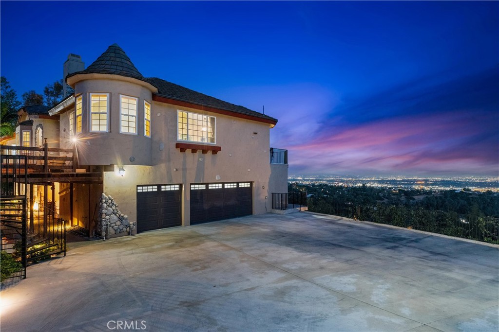 In a city with many unique homes and estates, 918 Reposado stands out for its combination of extraordinary views, size of home (4,300+), quiet location, street frontage (a remarkable 310 feet!), on-site parking for 16 cars and lush grounds with literally over 100 palm, ficus and fruit trees. Per seller: over 100 trees and most are mature! 42 palm, 42 ficus, 5 pine, 7 orange, 5 peach, 2 apple, 2 persimmon, 2 pear, 2 pomegranate, plus lots of bamboo and Jasmine! ** In the entire city of La Habra Heights, there are only 2 others for sale that are under $2.5M and 4,000+ SF. ** VIEWS!!! Sweeping, panoramic views from balconies, yards, kitchen, living room, dining area, family room and the primary bedroom. Plus there is a seeping view from both massive outdoor balconies, and from most of the yard spaces. Perfect view of the private Hacienda Golf Club. Panoramic 180+ degree views overlooking Los Angeles & Orange County out to Catalina Island. Easily see the Disneyland fireworks every night! ** ADU potential: plenty of open land on-site or convert all or part of the 3 car garage (with adjacent 200 SF guest room) to an ADU or JADU. There is still TONS or flat and private on site parking. ** 3 fireplaces including one in the primary. 5th bedroom is currently used as an office. Has its own closet. Massive primary suite and bathroom. ** Spent over $500,000 on landscaping, hardscaping, hundreds of feet of retaining walls, creating private pathways down and across the back slope. You could have literally hundreds of vegetable plants in the backyard! ** Kitchen - huge, open, high ceilings, tons of light and big views. Butcher block island counter. ** GARAGE and PARKING: Epoxy paint garage floors - very clean look. ** TWO air-conditioners so you will always feel cool and fresh! ** Nestled at the top of the Reposado culdesac…such a serene location! There are only 6 homes past this one. Quiet and private. ** Wine room, above ground, in the backyard. Fits 400+ of bottles. ** In front of the home is a beautiful, hand made water feature with hundreds of river rock stones, and a small waterfall! Soothing and gives you a fully shaded area to cool your feet day or night. A unique feature. ** There is 2,500 SF of balconies and decks around the home.