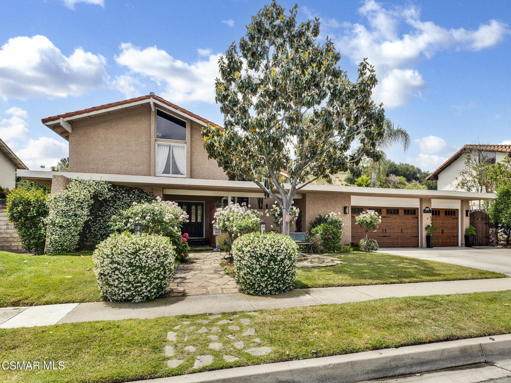 Charming & Upgraded Retreat with Private Pool in Coveted Foxmoor Cove! Welcome to 2026 Bridgegate Court--a beautifully appointed 4-bedroom, 3-bathroom home offering 2,336 square feet of stylish living in one of Westlake Village's most desirable neighborhoods. Nestled on an 8,276 square foot lot, this thoughtfully enhanced residence delivers stunning curb appeal, sophisticated interior upgrades, and a private entertainer's backyard. The exterior greets you with expansive grass lawns, mature landscaping, rustic upgraded garage doors, and stone walking paths leading to a serene gated front courtyard. The elegant entry reveals striking stone floors, upgraded double doors, and introduces the handsome wainscoting and rich wood flooring found throughout the home. The Living Room is a BRIGHT & open room showcasing soaring vaulted ceilings, large windows with views to both the front and back yards, and a classic brick-surfaced gas fireplace. Nearby, the Formal Dining Room enjoys tile flooring and sliding glass doors to the backyard. An additional informal dining area flows into the gourmet Kitchen which highlights QUARTZ countertops, custom cabinetry, step-in pantry with glass pantry door, mosaic-tile backsplashes, stainless-steel appliances, and a central stone flooring inlay. Downstairs includes a spacious guest bedroom with plush carpet and a 3/4 upgraded hall bathroom with redone shower and backyard access. Upstairs, two secondary bedrooms feature vaulted ceilings, character details like wood-paneled walls and plantation shutters, and utilize a hall bath with a standalone soaking tub and pedestal sink. The Primary Suite impresses with its tall ceilings, plush carpet, TWO closets, and a completely REMODELED en-suite bath with marble-topped dual vanities and an EXPANDED pebble-finished shower. The backyard is a COMPLETE private sanctuary designed for outdoor enjoyment--featuring a stone-ribboned pool, vaulted patio cover, above-ground Jacuzzi, built-in fire pit under a gazebo, and a ZEN pond area surrounded by tropical foliage. Brick planter walls and fencing frame the space beautifully and you will love your fruitful Apple, Orange, Peach, Lemon, Lime, Avocado, and Pomegranate trees! This home backs to Triumph Creek, offering seasonal creek views and tranquil hillside privacy. Located near award-winning Conejo Valley Unified schools (including Westlake High!), shopping centers, fine dining, and scenic hiking trails. Enjoy Westlake Village's year-round mild climate and proximity to Westlake Lake, community tennis courts, golf courses, and the Santa Monica Mountains. A rare opportunity in a sought-after location!