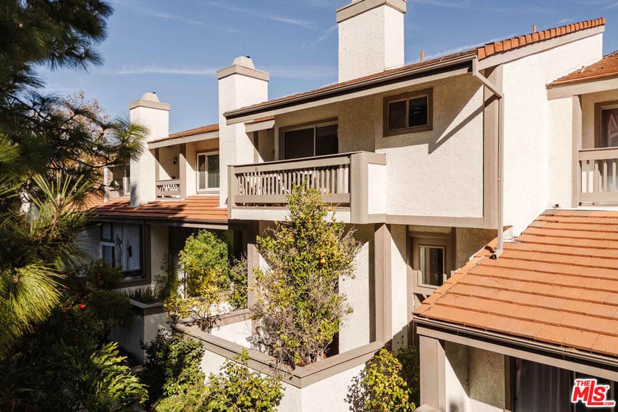 Nestled in the sought-after Palisades Highlands, this townhome enjoys privacy, serene mountain views, and an inviting ambiance. The heart of the home features a living room with soaring ceilings, a cozy fireplace, and seamless access to a private outdoor patio. The spacious kitchen, equipped with stainless steel appliances, flows into a formal dining area, with a laundry room and powder room conveniently completing the lower level. Upstairs, the primary suite impresses with vaulted ceilings, a generous bathroom with dual vanities, and a shower with bench. Down the hall find two guest bedrooms that share a full bathroom with shower and tub, as well as ladder access to a loft area.  Additional highlights include hardwood floors, central AC, and a direct-access two-car garage. Although untouched by the Palisades Fire, the residence underwent full remediation. The community offers 24-hour security patrols and is beautifully framed by lush, mature landscaping. Residents can enjoy a range of amenities, including a swimming pool, spa, dry saunas, and a gym. For an additional fee, homeowners can join the nearby Highlands Park featuring expansive greenspaces and designated off-leash hours for dogs. With its welcoming atmosphere and strong sense of community, the Highlands continues to thrive. This exceptional townhome combines comfort, convenience, and community in one perfect package.