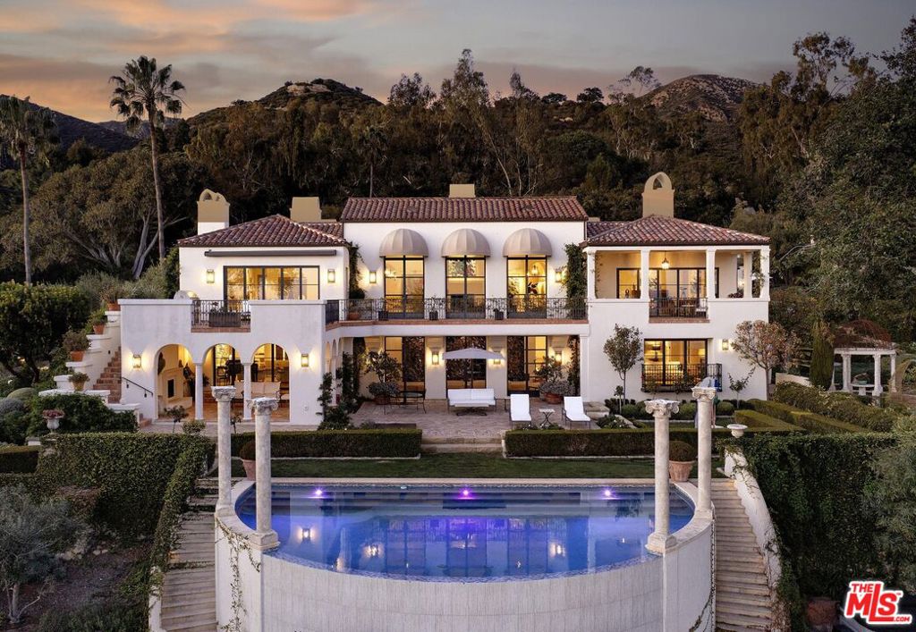 Enter the private gates of this grand and wholly reimagined 6.2-acre ocean view coastal estate that is Montecito's beloved and historic ''Ca di Sopra'' (House Above the Clouds) first built in 1914 by famous architect Guy Lowell and completely redesigned in recent days. The owner spared no expense to fundamentally transform and elevate this 7-bedroom, 8-bathroom Italian Villa's classical architecture to today's most rigorous standards and top design. From the meticulous landscaping surrounding the prominent half-moon pool beset by Greek Ionic columns, to the temperature-controlled wine cellar/tasting room, multiple entertainment balconies overlooking the Pacific Ocean, home theater, two gracious family rooms, gourmet kitchen, formal dining room, large gym, and a truly impressive primary suite featuring an enviable indoor/outdoor bathroom, walk-in closet, and sweeping sitting areas opening to the stone terraces, there is no shortage of awe-inspiring venues throughout the property. Lending to the versatility and functionality of this compound is a modern two-bedroom guest house above the three-car garage and a carriage house with bathroom that could be a perfect artist retreat. This rare opportunity is reserved for the most selective buyers.