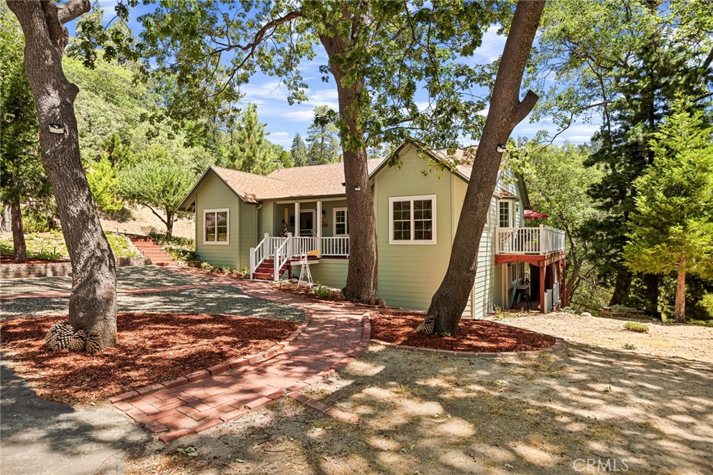 Nestled on a quiet cul-de-sac in Smiley Park Country Club you will feel peace and tranquility on this 1.25 acre lot! This beautiful home has so much to offer. including newer carpet 2021, wood floors, newer windows 2021, newer roof 2021, exterior painted 2021, hardy board siding and more! On the main floor the house features a living room w/fireplace insert, a large great room w/vaulted ceiling, an office/den, two bedrooms, full bath, kitchen & dining area, large walk-in pantry with laundry hookups. The downstairs features 2 bedrooms, full bathroom with a large walk-in shower, full size spa, laundry room with access to a workshop and small porch. A large hardy board deck (requiring no maintenance) is accessible from the main floor is perfect for large family gatherings or just relaxing and listening to the surrounding wildlife! Enjoy the Smiley Park club house with pool, bbq, and picnic area perfect for any family gatherings. With just minutes to the local ski resort and hiking trails are just a few of the many community features. Make this custom built home your next forever home!