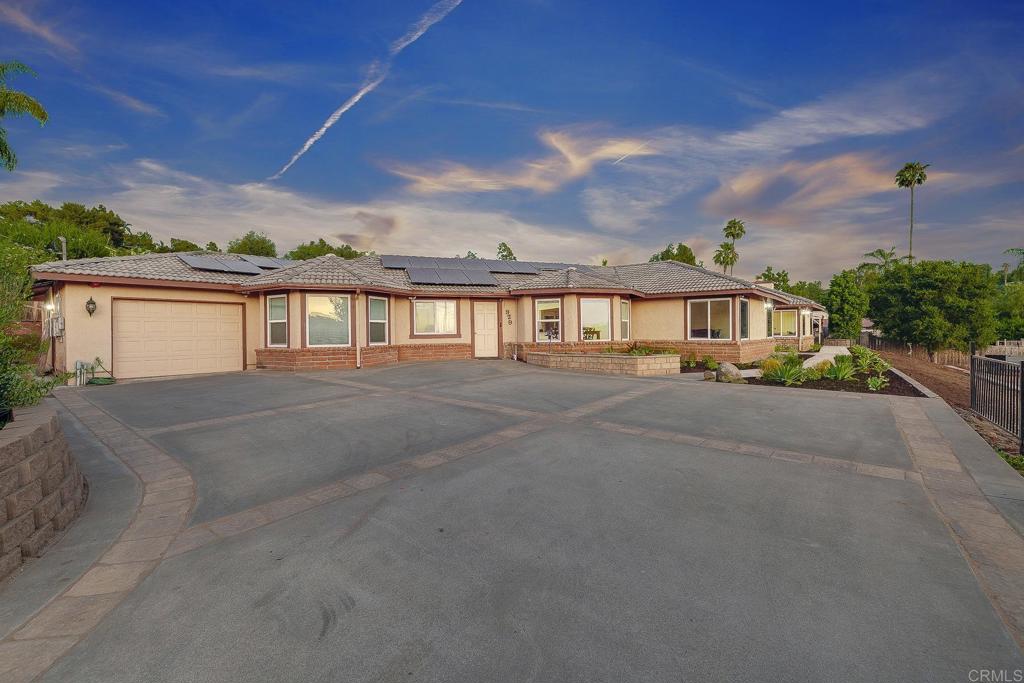 Outstanding Vista propertunity---this one has it ALL! Spacious 1.54 -acre lot, huge & updated single story main home, attached casita with its own kitchenette, tiny home on wheels, 3 oversized RV spots with water & power, plus SPACE to add a pool, animals like horses, goats, & chickens, a resort-style backyard, potential ADUs...the list goes on! Do not miss out on this one that is priced to sell quick in one of Vista's most desirable neighborhoods. Short drive to freeways, revitalized Downtown area, Cal-a-Vie, & the beach in Oceanside! The main home is huge with 5 bedrooms & an office area, large living spaces, tons of light, & a gorgeous updated kitchen with white cabinetry, stainless steel appliances, an oversized eat-at kitchen island with additional storage & walk-in pantry. A W/D was installed in the primary walk-in closet, including hot/cold water lines, drainage, a dryer vent, & a 220V outlet. In addition to the original primary suite with spacious ensuite bath, a second primary suite was created to allow increased flexibility & functionality of the floor plan. Part of the garage was converted into a dedicated office with half bath — ideal for remote or hybrid work. The attached casita with its own kitchenette is perfect for a nanny or property manager. It features its own private entrance, full kitchen (no washer), living room, large bedroom, & full bathroom. The entire house is wired with Cat6 cable, ready for mesh network & camera security system. The driveway & backyard was upgraded with Italian pavers. The spacious outdoor area is hardscaped & incredibly low maintenance. It features a hot tub & an external storage shed. A gate provides privacy & safety for kids & pets. The sellers terraced the 1.5-acre lot using beautiful Italian retaining wall blocks to create an upper terrace for the main house with a flat 0.25-acre area below with a long gravel driveway leading down to the tiny house & RV sites. The tiny house on wheels features an elevated wrap-around deck, a separate electrical sub panel (shared with RV sites), an electric water heater, connected water line, & a 2,000-gallon septic holding tank with 4” overflow pipe (perforated and spread across property) with easy access for future pumping. Each RV site (total of 3 on property) includes two water hookups, a 32-amp electrical hookup, connected water lines. The RV area also shares an electrical sub panel with the tiny house. The exterior laundry close can accommodate up to 2 washers and 2 dryers (gas or electric) & includes a dedicated electrical sub panel. Property includes a 60-panel solar system, a comprehensive French drain system, & a mesh network that covers the entire 1.5-acre property. All water lines on the property were converted to 1-inch lines. The sellers also planted 35 fruit trees just last month! This North County San Diego Dream Propertunity offers massive amounts of value, flexibility for multi-generational living & income potential, not to mention a sizeable lot to create your personalized resort-style oasis in the back hills of Vista. Do not miss this one!