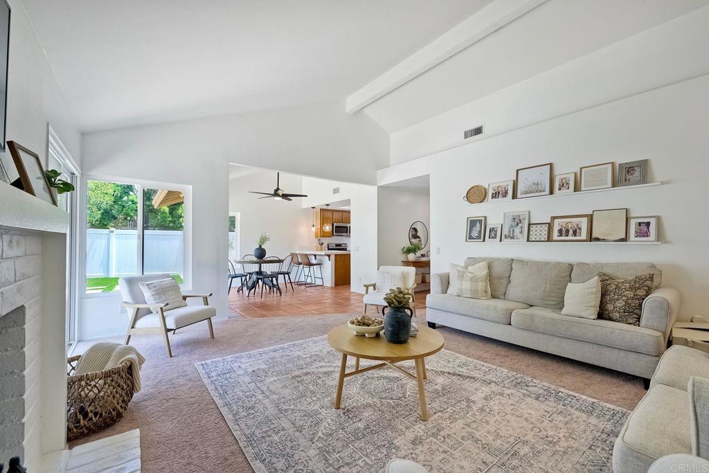 This charming home is full of warmth, natural light, and thoughtful updates — perfectly situated on a quiet cul-de-sac with stunning Pala Mesa golf course views. It is a light and bright retreat nestled in the heart of beautiful Fallbrook, yet still freeway close for your convenience! Step inside to soaring ceilings and an open, airy layout that creates a sense of space and comfort the moment you walk through the door. Large updated windows invite in the sunshine and frame peaceful vistas of the surrounding greenery, making every day feel like a breath of fresh air. The updated laundry room adds both style and function, while the rest of the home boasts a timeless charm with fresh, modern touches throughout. Whether you're hosting a lively gathering or simply enjoying a quiet evening under the stars, the entertainer’s backyard is your own private paradise. With one of the larger lots in the community, sit among your own beautiful landscaping, with modern turf and concrete pads, Pergola and a custom glass back fence to take in the views of the golf course, mountains and vineyards. There is plenty of room to relax or dine al fresco, it’s the perfect spot to unwind and make lasting memories. Don’t miss this rare opportunity to own a slice of Fallbrook tranquility — where every day feels like a getaway!