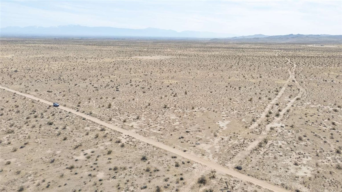 Own 10 acres of flat desert land in Adelanto’s High Desert with no HOA and endless possibilities. Zoned for 1 unit per 2.5 acres, the property allows mobile homes, RVs, livestock, farming, and off grid living. A septic system is already installed, while a well would be needed for water. Power is not connected, making the property best suited for solar or generator setups. Access is by a well traveled dirt road, offering seclusion while remaining close to Highway 395. Adventure awaits nearby at El Mirage Dry Lake for off roading, land sailing, and outdoor recreation. Explore Silverwood Lake, local hiking trails, and Joshua Tree forests just a short drive away. Adelanto continues to grow with amenities such as Desert Trails Park, Sierra Park, and Adelanto Stadium hosting community events. Whether you are looking to build a retreat, start a ranch, or hold as an investment, this property delivers space, freedom, and opportunity in the Southern California desert.