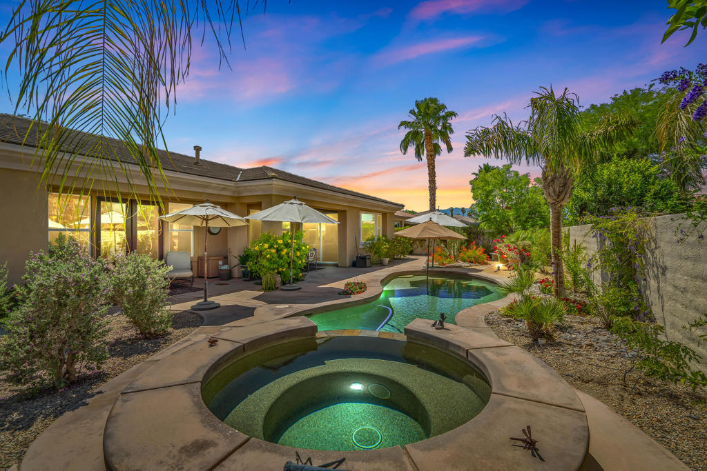 GRAND TIMELESS ELEGANCE! Located in the gated community of Brenna at Capri in highly sought after Palm Desert. This fabulous 4 bedroom/4 bathroom home is ideally located close to Ronald Regan Elementary School and vibrant Freedom Park, home to public Pickle Ball Courts and Sports Fields. Enter from a richly landscaped front yard into a delightful courtyard with sitting area and custom stone fireplace. The generously sized detached Casita is the perfect spot to host guests or use as a private office. Enter the main house through an opulent Foyer and be greeted by an open Living Room featuring a wet bar, spotlights for artwork and French Doors that open to the alluring Pool/Spa area. The formal Dining Room is brilliantly appointed with French Doors the open to the Courtyard offering loads of natural light! The Family Room is warmed by a cozy fireplace and is open to the Kitchen and Breakfast Nook. The Gourmet Chef's Kitchen is an entertainer's DREAM! Boasting solid wood cabinetry, granite slab counter tops, dual ovens, 5 burner gas cook top, pot filler faucet, backsplash with artful copper inlay, pantry, large island with Breakfast Bar and eat-in Breakfast Nook! The masterful Primary Suite is a tranquil retreat with large sitting area, 2 walk in closets, dual vanities, stone shower with laser cut tile trim and soaking tub overlooking the citrus garden! Nicely separated are 2 Guest Bedrooms adjoined a Jack 'n Jill bathroom. The Backyard is adorned by stone walkways tucked into lush desertscape and citrus trees, completed by a pebble tec pool, raised spa with cascading waterfall! Fine finishes and quality upgrades are found here including double crown molding, wainscotting, surround sound speakers, solar system, custom closet design, security system and newer pool heater and pool pump! Not to be forgotten is the 3 car garage with custom cabinetry and work bench with direct home access! Lovingly and Meticulously maintained by the original owners, this is a TRUE find! ELEGANT COMFORT with the BEST in indoor/outdoor living!