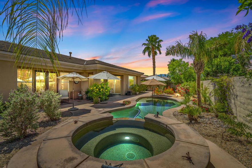 GRAND TIMELESS ELEGANCE! Located in the gated community of Brenna at Capri in highly sought after Palm Desert. This fabulous 4 bedroom/4 bathroom home is ideally located close to Ronald Regan Elementary School and vibrant Freedom Park, home to public Pickle Ball Courts and Sports Fields. Enter from a richly landscaped front yard into a delightful courtyard with sitting area and custom stone fireplace. The generously sized detached Casita is the perfect spot to host guests or use as a private office. Enter the main house through an opulent Foyer and be greeted by an open Living Room featuring a wet bar, spotlights for artwork and French Doors that open to the alluring Pool/Spa area. The formal Dining Room is brilliantly appointed with French Doors the open to the Courtyard offering loads of natural light! The Family Room is warmed by a cozy fireplace and is open to the Kitchen and Breakfast Nook. The Gourmet Chef's Kitchen is an entertainer's DREAM! Boasting solid wood cabinetry, granite slab counter tops, dual ovens, 5 burner gas cook top, pot filler faucet, backsplash with artful copper inlay, pantry, large island with Breakfast Bar and eat-in Breakfast Nook! The masterful Primary Suite is a tranquil retreat with large sitting area, 2 walk in closets, dual vanities, stone shower with laser cut tile trim and soaking tub overlooking the citrus garden! Nicely separated are 2 Guest Bedrooms adjoined a Jack 'n Jill bathroom. The Backyard is adorned by stone walkways tucked into lush desertscape and citrus trees, completed by a pebble tec pool, raised spa with cascading waterfall! Fine finishes and quality upgrades are found here including double crown molding, wainscotting, surround sound speakers, solar system, custom closet design, security system and newer pool heater and pool pump! Not to be forgotten is the 3 car garage with custom cabinetry and work bench with direct home access! Lovingly and Meticulously maintained by the original owners, this is a TRUE find! ELEGANT COMFORT with the BEST in indoor/outdoor living!