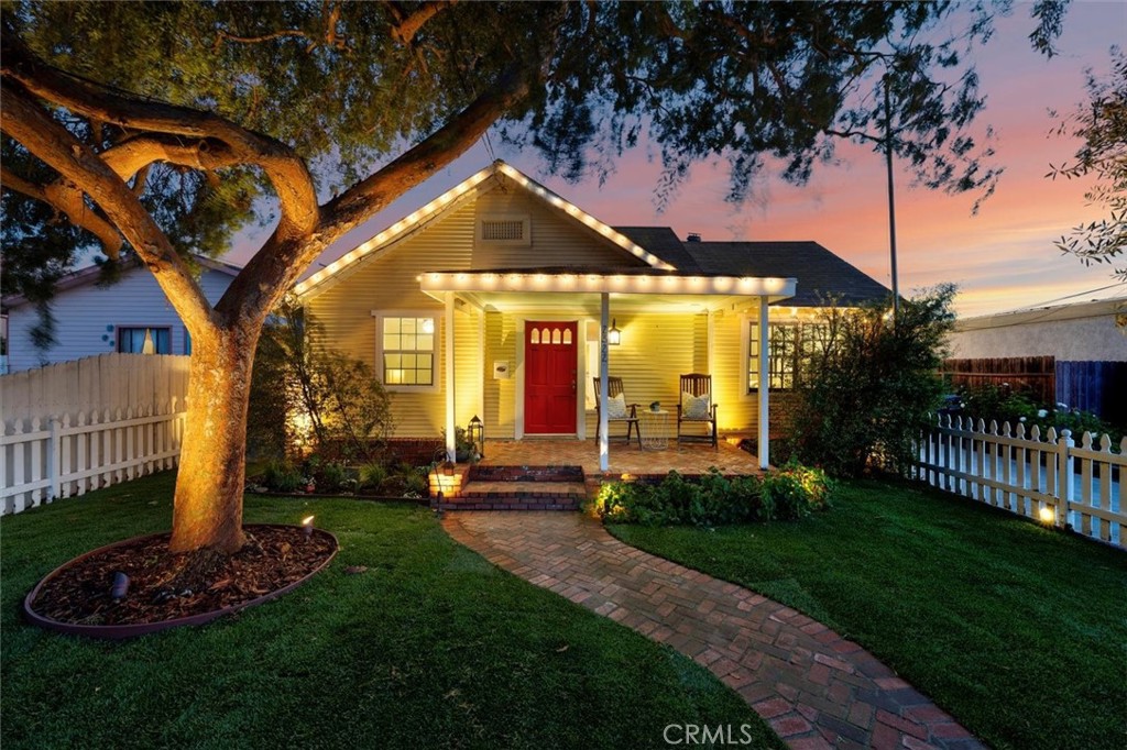 Charming and full of character, this beautifully preserved historic California Bungalow exudes a truly homie vibe. Offering 3 bedrooms, 2 bathrooms, and 1,353 sq ft of inviting living space on a spacious 7,551 sq ft lot in the heart of Lomita, this home seamlessly blends timeless charm with modern comforts. The cozy living room boasts a classic fireplace, perfect for relaxed evenings. Step outside into your own private oasis, featuring a serene pond, lush herb garden illuminated by perfect lighting, and a backyard wired for a built-in firepit and outdoor sound system, ideal for entertaining under the stars. This rare gem captures the essence of historic allure while embracing a warm, homey atmosphere that makes you feel right at home.
