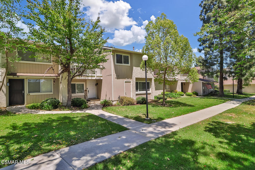 Discover the perfect blend of comfort and style in this beautifully updated 4-bedroom, 3-bathroom townhome, the largest floorplan in the Varsity Park Villas. This home offers thoughtful features like recessed lighting and a completely remodeled and reconfigured open concept kitchen with stainless steel appliances and a dining area that flows into the large living room with a cozy fireplace. Both living and dining areas have direct access to the large, private backyard/patio with newer patio cover, perfect for upcoming summer BBQ's! The lower level bedroom and full bathroom are an ideal setup for a home office, as a private guest room or for multi-generational living. This townhome comes with upgraded dual pane windows, brand new AC, newer furnace and ductwork, a spacious primary retreat with en-suite bath and a private balcony, and 2 well sized secondary bedrooms upstairs. This home also includes a private 2 car garage and an additional designated parking space right next to the garage. The HOA offers 2 sparkling pools, 2 clubhouses, tons of lush landscaping and ample guest parking on the street. Just minutes from several community parks, a dog park, the Moorpark College and Zoo, the Rustic Canyon Golf Course, shops, dining and quick access to the 118 freeway. This turn-key townhome is a must see!