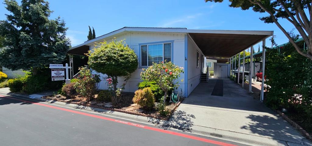 Step into timeless charm at this 1977 double-wide mobile home in Fox Hollow, an intimate 55+ community in Sunnyvale. This lovely residence offers two spacious bedrooms and two full bathrooms making it perfect for comfortable, independent living in a welcoming senior-friendly environment. The heart of the home is its bright, open kitchen, equipped with essential appliances, generous cabinet storage, and ample counter space, seamlessly extending into a cozy family room. Adjacent, a light filled living area opens to a charming porch, ideal for savoring your morning coffee or hosting gentle afternoon gatherings. A convenient laundry room and a shed offer plenty of storage for everyday needs or hobbies. Outside, a covered carport ensures easy parking, whether for one vehicle or more. Located conveniently close to shopping, dining, and major highways, this home combines a legacy layout with practical updates and outdoor amenities perfect for relaxed, active days.