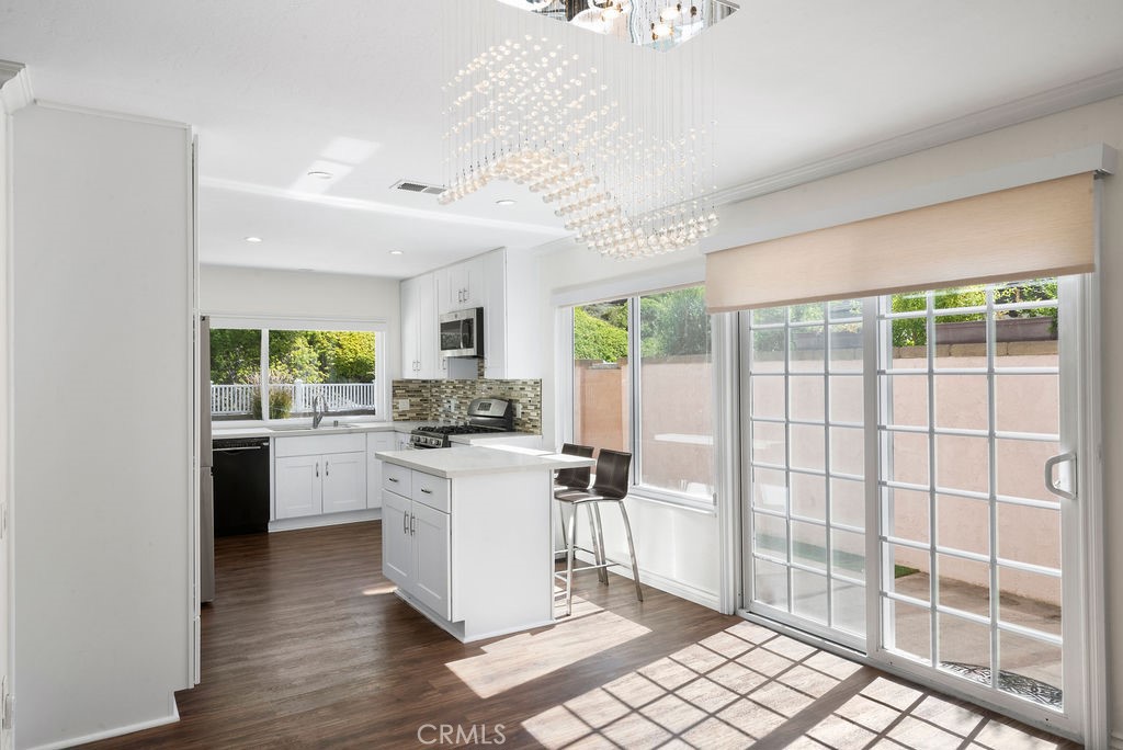 Discover your dream home in the heart of Mission Viejo! This beautifully remodeled, single-level residence sits on a large, private lot in the sought-after Castille neighborhood (New Castille, Central CA2). With 4 bedrooms and 2 bathrooms across 1,640 sq ft of elegant living space, this home blends comfort and style from top to bottom.
Step inside to soaring ceilings, crown molding, recessed lighting and a whole-house fan. The spacious living room features a custom fireplace and flows seamlessly into a chef’s kitchen equipped with newer cabinetry, quartz countertops, stainless steel appliances, a stylish tile & cut-glass backsplash and an island perfect for casual dining or entertaining. Dual-pane windows and sliding doors open to reveal a backyard oasis boasting low-maintenance artificial turf, a custom fire pit, and ample room for outdoor entertaining.
Other upgrades include vinyl plank flooring throughout, PEX re-piping, epoxy-floored 2-car attached garage with natural light, plus enhanced privacy and lush landscaping both front and rear.
With its prime location, enjoy easy access to Lake Mission Viejo, local parks, shopping, and top-rated schools: Castille Elementary, Newhart Middle, and Capistrano Valley High. This gem represents refined single-story living in one of Mission Viejo’s most desirable settings.