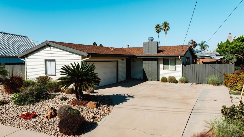 Tucked away on a quiet cul-de-sac in central Clairemont, this updated 4-bedroom, 2-bathroom mid-century home is ready for it's next caretaker. The kitchen has been refreshed with new appliances and contemporary finishes, while both bathrooms have been stylishly updated. Original hardwood floors have been beautifully refinished, offering warmth throughout the home.  This property is truly turn-key and move-in ready—with a layout designed for easy living and entertaining. Step outside and you'll find a private backyard oasis featuring a sparkling pool, mature landscaping and grapefruit tree, and serene canyon views—no neighbors behind you, just peace and privacy. Bonus: there's rare RV or boat parking on the side of the home.  Located in the desirable Clairemont Mesa neighborhood, you're within walking distance to local schools and just minutes from major freeways, top-rated eateries, and shopping hubs. Whether you're heading to the beach, Downtown, or anywhere in between, this location puts you in the center of it all.  Don’t miss this opportunity to own a slice of classic San Diego with room to relax, entertain, and grow.