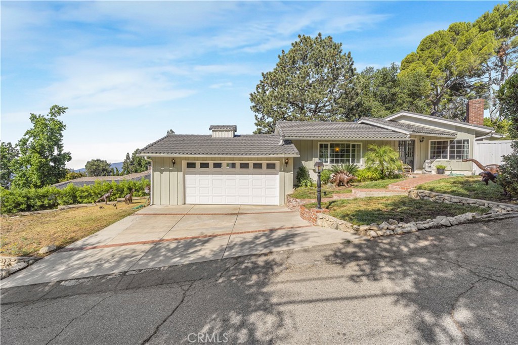 THIS HOME IS FOR SALE OR FOR LEASE.
Welcome to this inviting 3-bedroom, 2-bathroom home in the highly sought-after Briggs Terrace neighborhood of La Crescenta. Situated on a flat 8,808 sq ft lot, this 1,485 sq ft residence offers a comfortable layout filled with natural light, featuring large windows and multiple doors that open seamlessly to the outdoor living areas. So close to restaurants, shopping, and freeways...yet the quiet privacy is hard to beat.
The main bedroom includes a private ensuite (3/4 bath), while a full bathroom for guests and family is in the hallway. The bright kitchen takes in stunning views of downtown Los Angeles and beyond, creating a perfect backdrop for daily living. Appliances are included, and the home provides abundant storage both inside and in the attached 2-car garage. The expansive, fully fenced backyard is ideal for entertaining, gardening, or future possibilities such as an addition or pool. Adding to its charm, the outdoor spaces are accented with whimsical dinosaur décor, bringing a playful and distinctive character to the property. Located within the boundary of the highly regarded Mountain Avenue Elementary School, this home combines comfort, convenience, and opportunity. Don’t miss your chance to own a home in this desirable La Crescenta community!
Additional photos coming soon.