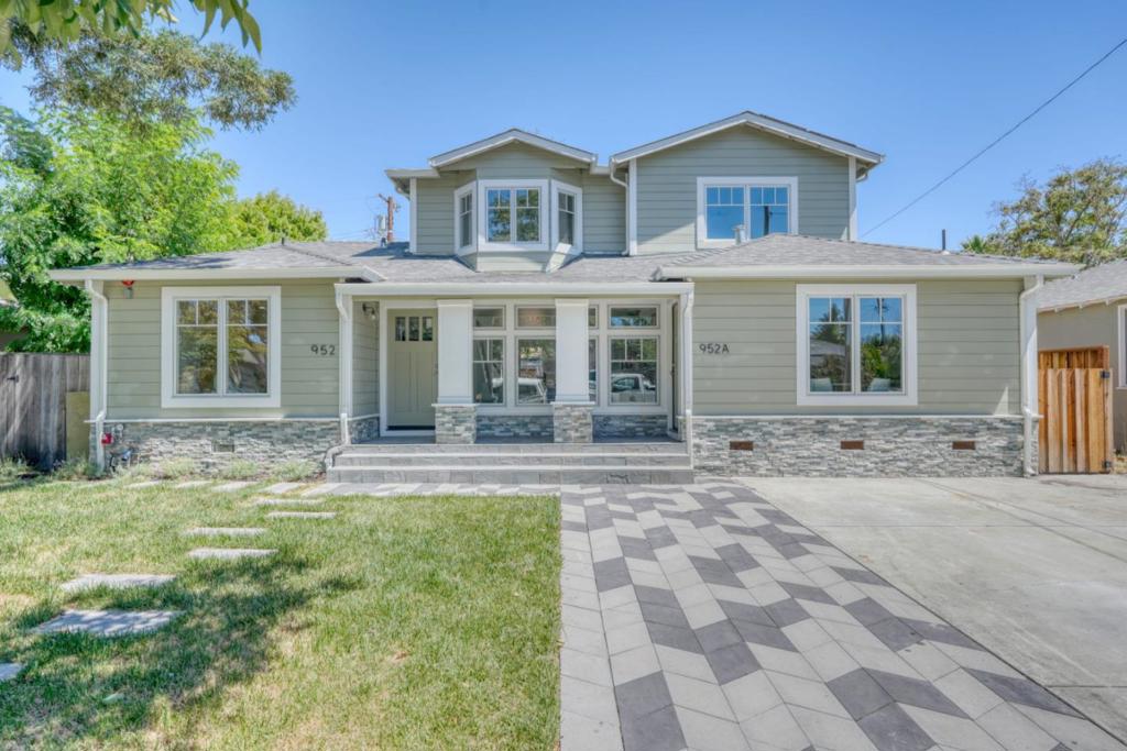 Fully rebuilt on a tree-lined street in the coveted Avenues, this two-story home blends modern comfort & designer finishes. A spacious living area & chefs kitchen with center island, quartz counters, high-end appliances, a full-size restaurant-style fridge & freezer. The main floor includes three bedrooms--two with en suite bathsgenerous closet space. Upstairs offers a vaulted lounge or office, laundry room, a luxurious primary suite with walk-in closet, double vanity, soaking tub, & stall shower. Indoor-outdoor living shines with a fully designed system: expansive wood deck, gas fire pit, BBQ stand, TV hook-up, lighting, & drought-tolerant landscaping. The home is pre-wired for built-in speakers, allowing sound to flow seamlessly inside & outperfect for entertaining. Designed ADU has separate entry, full kitchen, full bath & utilityideal for guests, in-laws, or rental income. HVAC, solar, new plumbing, elec, & roof. Expanded driveway w/ample parking. Walk to parks, shops & transit. Turnkey living in the heart of the city.